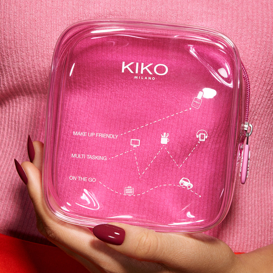 "Person holding KIKO Milano Mini Pink Transparent Beauty Bag"