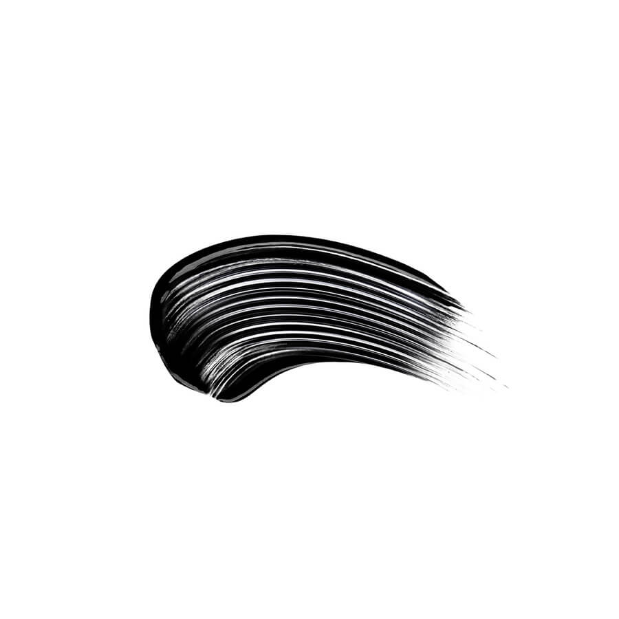 "Sweep of black mascara on a white background, illustrating the texture and consistency of the product."