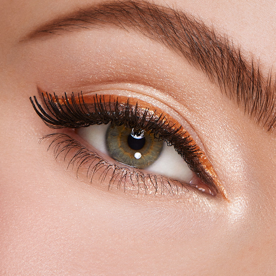 "Detailed View of Brown Eye with KIKO Milano Eyeliner and Voluminous Mascara Application"