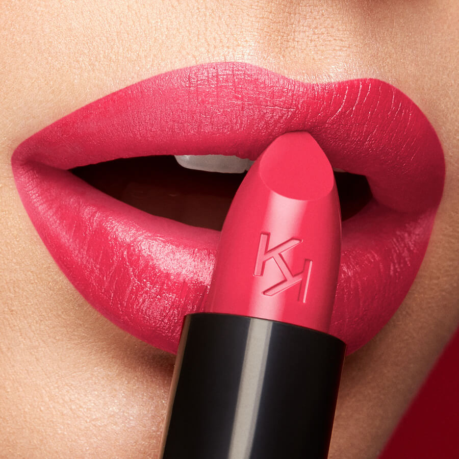 "Close-up of KIKO Milano vibrant red lipstick on full lips emphasizing the rich pigment and smooth texture."